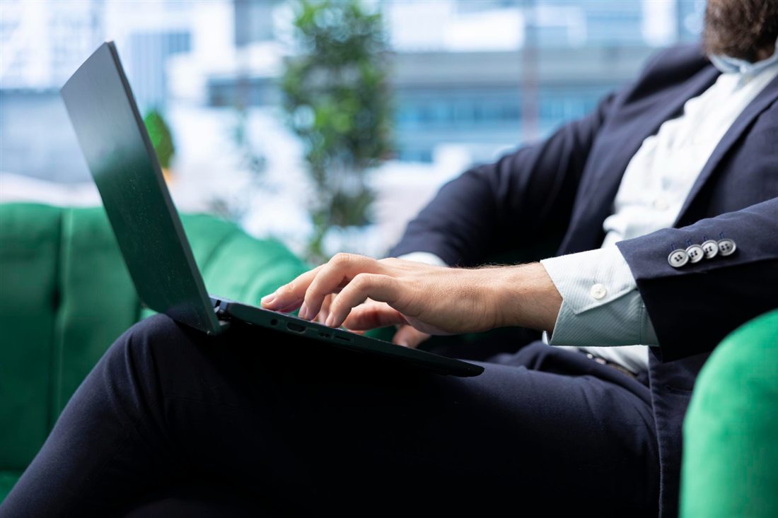 Broker posting from a laptop